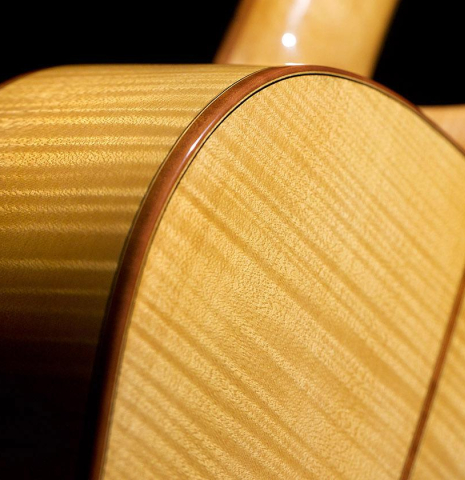 The back and side of a 2020 Youri Soroka classical guitar made with spruce top and maple back and sides.