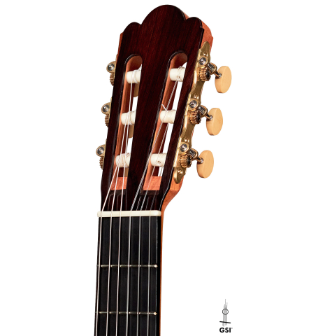 The headstock and machine heads of a 2022 Youri Soroka &quot;Torres&quot; classical guitar on a white background