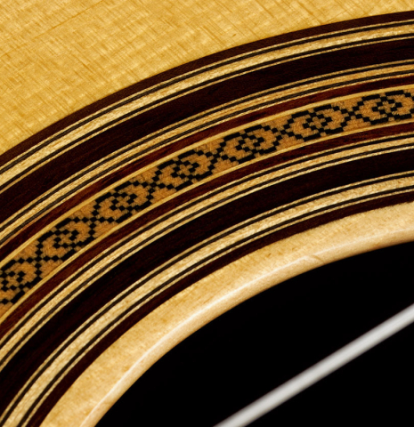 Closeup of the rosette of a 2023 Youri Soroka "1924 Santos, ex Segovia" classical guitar made of spruce and Indian rosewood