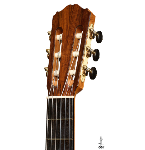 The headstock of a 2025 Youri Soroka classical guitar made of spruce and African rosewood