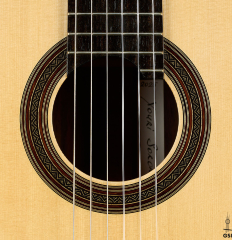 The rosette of a 2025 Youri Soroka classical guitar made of spruce and African rosewood