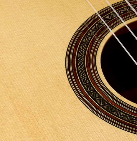 The soundboard and rosette of a 2025 Youri Soroka classical guitar made of spruce and African rosewood