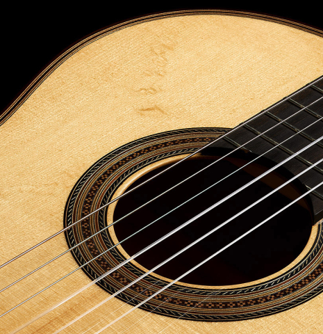 The soundboard and rosette of a 2021 Gary Southwell "1940 'Augustine' Hauser, ex-Bream" classical guitar made of spruce and maple