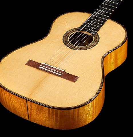 The top and sides of a 2021 Gary Southwell "1940 'Augustine' Hauser, ex-Bream" classical guitar made of spruce and maple