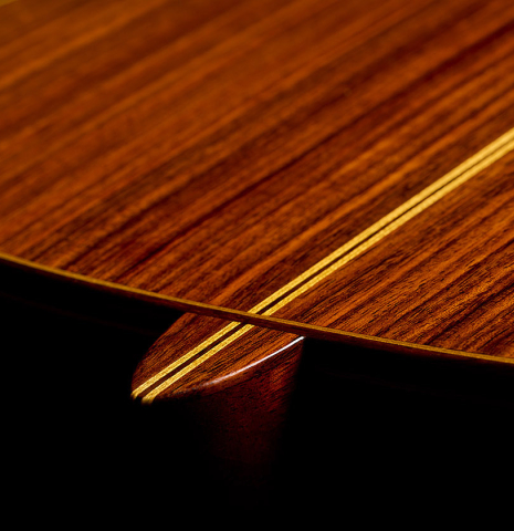 The heel, back binding and purfling of a 2001 Gary Southwell "1940 'Augustine' Hauser, ex-Bream" classical guitar made of spruce and Indian rosewood