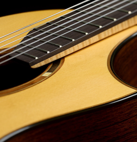 The elevated fingerboard and top of a 2003 Gary Southwell "A-Series" (ex Scott Tennant) classical guitar made of spruce and Indian rosewood