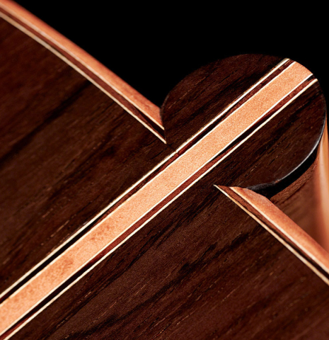 The heel of a 2022 Sebastian Stenzel classical guitar made of spruce and CSA rosewood