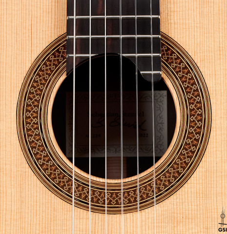 The rosette of a 2022 Sebastian Stenzel classical guitar made of spruce and CSA rosewood