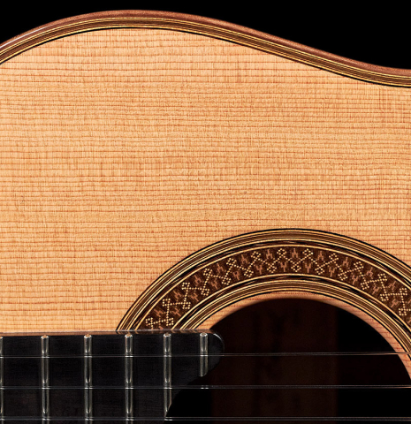 The soundboard and rosette of a 2022 Sebastian Stenzel classical guitar made of spruce and CSA rosewood