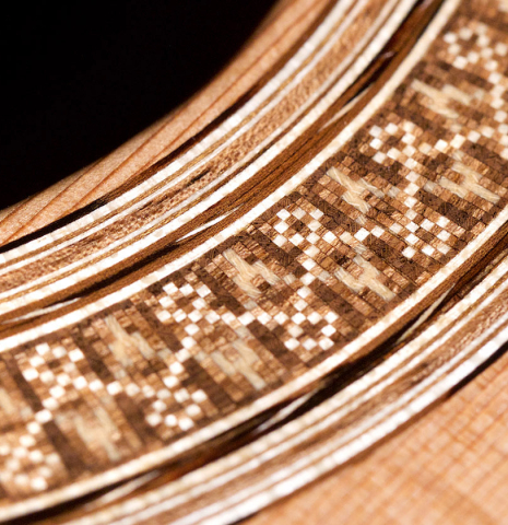 The rosette of a 2020 Sebastian Stenzel &quot;Enhanced Wood&quot; classical guitar made with cedar and CSA rosewood.