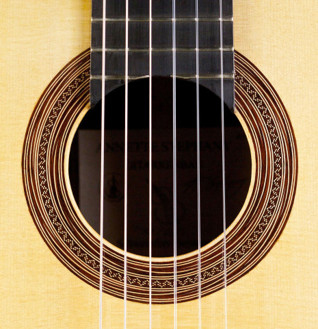 The rosette of a 2015 Annette Stephany classical guitar made with spruce and Indian rosewood