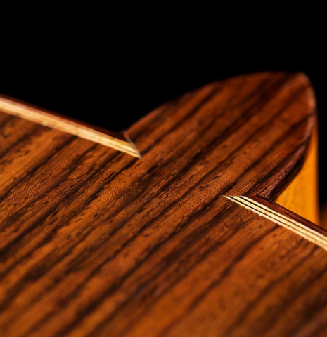 The heel, back binding and purfling of a 2017 Annette Stephany classical guitar made of spruce and Indian rosewood