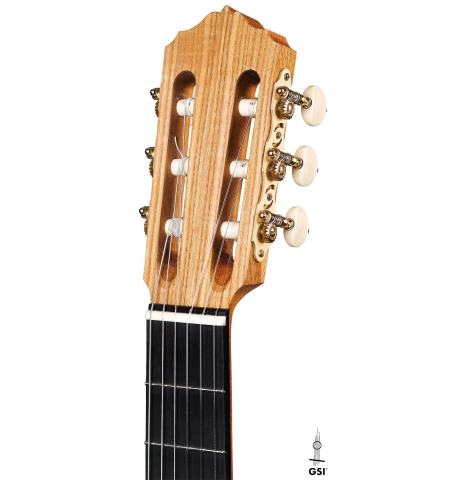 The headstock and tuners of a 2019 Annette Stephany made with cedar top and Ash back and sides