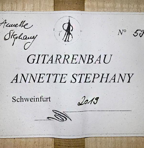 The label of a 2019 Annette Stephany made with cedar top and Ash back and sides