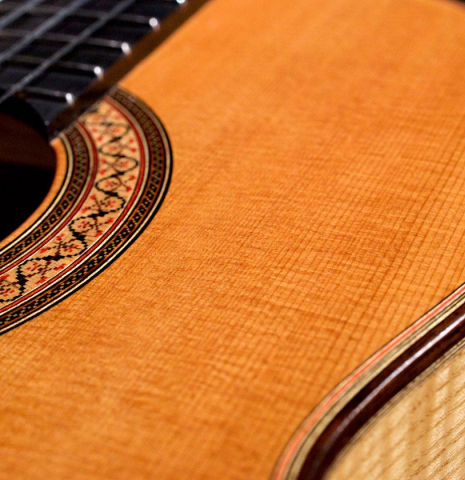 The soundboard, rosette and side of 2019 Annette Stephany made with cedar top and ash back and sides