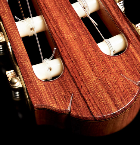 The headstock of a 2000 Sebastian Stenzel classical guitar made with cedar and Indian rosewood