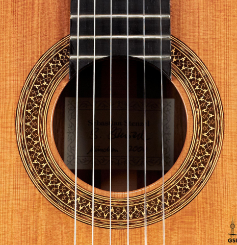 The rosette of a 2000 Sebastian Stenzel classical guitar made with cedar and Indian rosewood