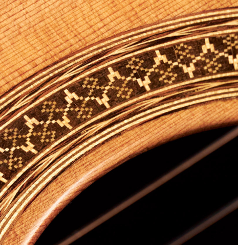 The rosette of a 2000 Sebastian Stenzel classical guitar made with cedar and Indian rosewood
