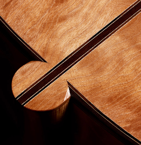 The heel, back binding and purfling of a 2024 Sebastian Stenzel classical guitar made of cedar and maple