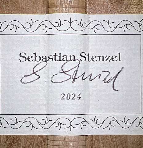 The label of a 2024 Sebastian Stenzel classical guitar made of cedar and maple