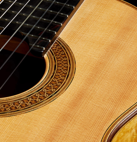Detailed closeup of the rosette of a 2023 Sebastian Stenzel classical guitar made of spruce and maple