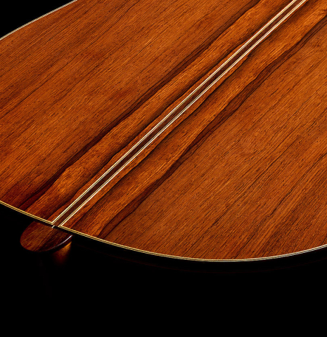The heel, back binding and purfling of a 2010 Sebastian Stenzel classical guitar made of spruce and African rosewood