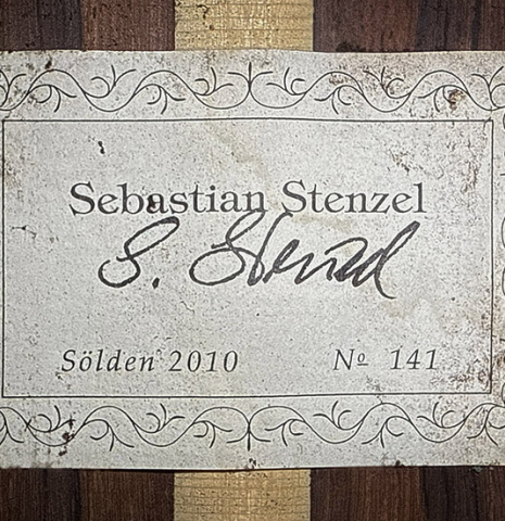 The label of a 2010 Sebastian Stenzel classical guitar made of spruce and African rosewood