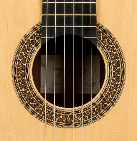 The rosette of a 2010 Sebastian Stenzel classical guitar made of spruce and African rosewood