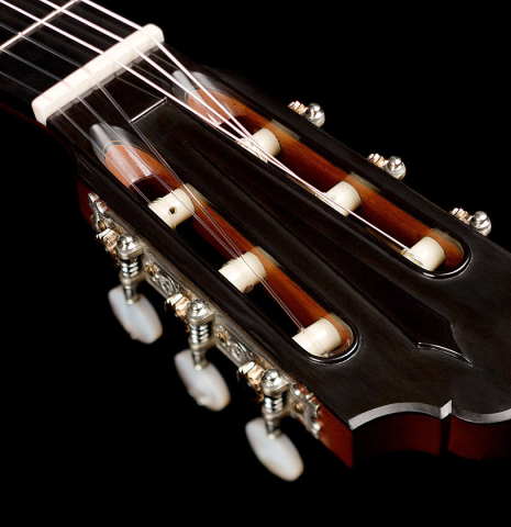 The headstock and machine heads of a 2022 Giovanni Tacchi classical guitar Friederich model made of cedar and Indian rosewood