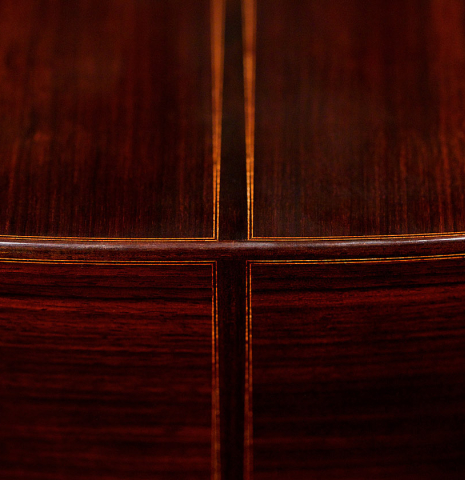 The back and sides of a 2022 Giovanni Tacchi classical guitar Friederich model made of cedar and Indian rosewood