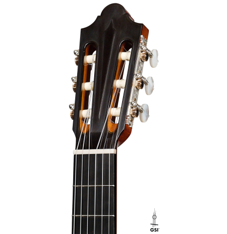 The headstock of a 2022 Giovanni Tacchi classical guitar Friederich model made of cedar and Indian rosewood