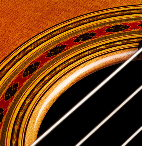 Closeup detail of the rosette of a 2024 Giovanni Tacchi classical guitar Friederich model made of cedar and Indian rosewood