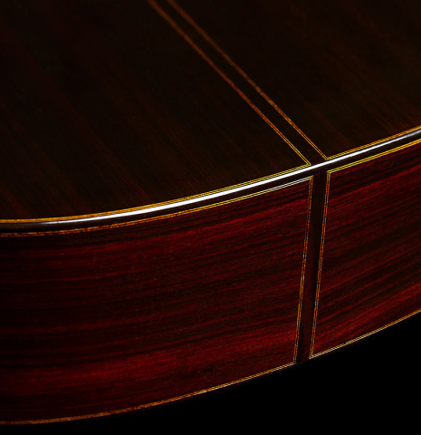 The back, sides and binding at the foot of a 2024 Giovanni Tacchi classical guitar Friederich model made of cedar and Indian rosewood