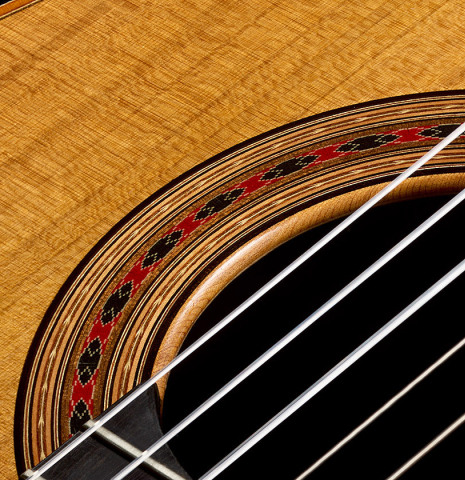 The soundboard and rosette of a 2026 Giovanni Tacchi classical guitar made of cedar and Indian rosewood