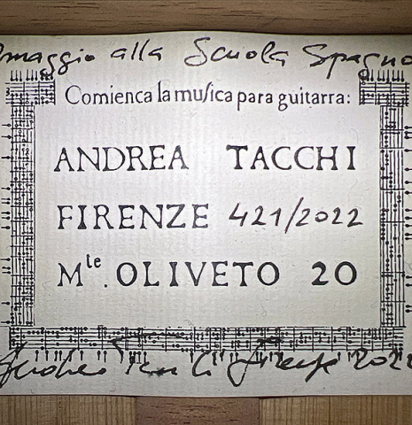 The label of a 2022 Andrea Tacchi &quot;Homage to the Spanish School&quot; classical guitar made with spruce and cypress wood