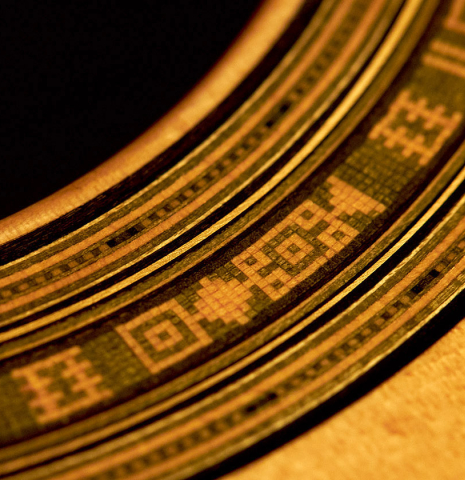 A close-up of the rosette of a 2022 Andrea Tacchi "Homage to the Spanish School" classical guitar made with spruce and cypress wood