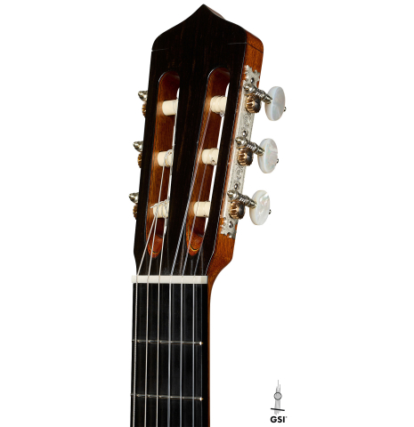 The headstock of a 2025 Andrea Tacchi "Coclea Thucea - Satin" classical guitar made of cedar/spruce and satinwood