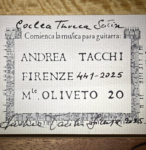 The label of a 2025 Andrea Tacchi "Coclea Thucea - Satin" classical guitar made of cedar/spruce and satinwood