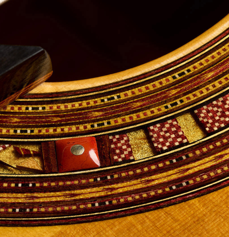 Detail of the rosette of a 2025 Andrea Tacchi "Coclea Thucea - Satin" classical guitar made of cedar/spruce and satinwood