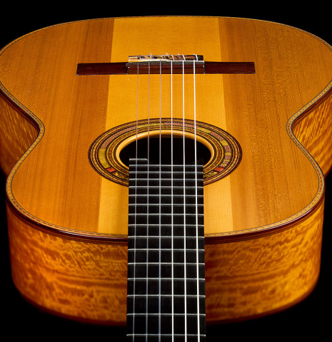 The soundbard and fingerboard of a 2025 Andrea Tacchi "Coclea Thucea - Satin" classical guitar made of cedar/spruce and satinwood