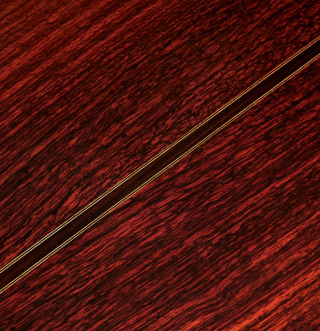 Close up of the back and center seam of a 2020 Giovanni Tacchi classical guitar Friederich model made of cedar and Indian rosewood