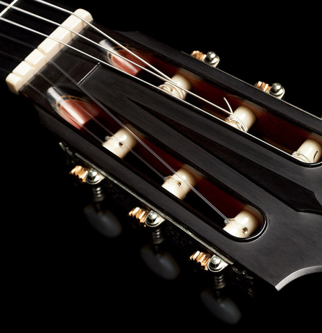 The headstock and machine heads of a 2020 Giovanni Tacchi classical guitar Friederich model made of cedar and Indian rosewood