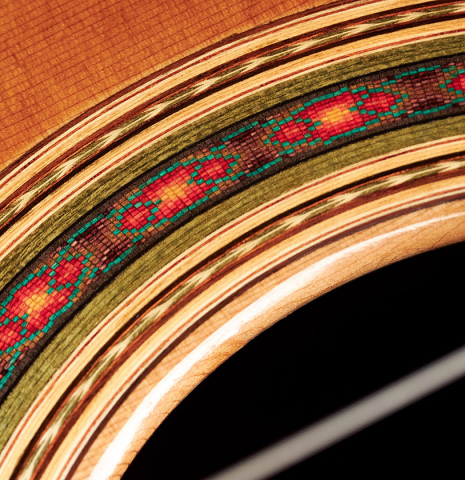 Detail of the rosette of a 2020 Giovanni Tacchi classical guitar Friederich model made of cedar and Indian rosewood
