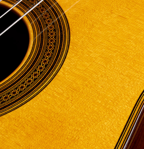 Closeup detail of the rosette of a 2010 Andrea Tacchi "Omaggio a Robert Bouchet" classical guitar made of spruce and CSA rosewood