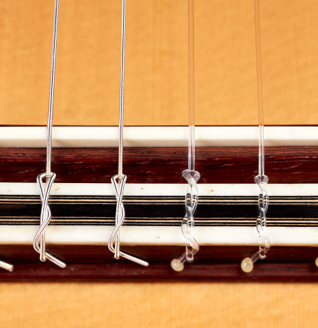 The bridge and saddle of 2022 Marco Tejeda "Chamberi" classical guitar made with sprue and African rosewood