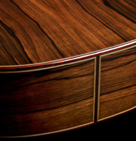 The back and sides at the foot of a 2026 Marco Tejeda "Chamberi" classical guitar made of cedar and green ebony