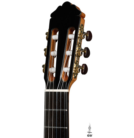 The headstock of a 2026 Marco Tejeda "Chamberi" classical guitar made of cedar and green ebony