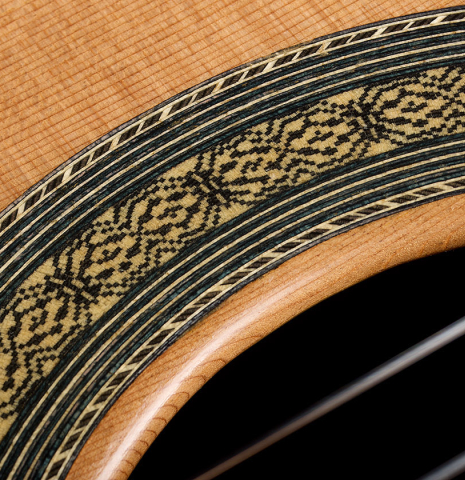 The rosette detail with mosaics of a 2026 Marco Tejeda "Chamberi" classical guitar made of cedar and green ebony