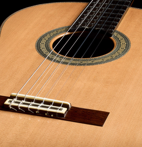 The soundboard of a 2026 Marco Tejeda "Chamberi" classical guitar made of cedar and green ebony