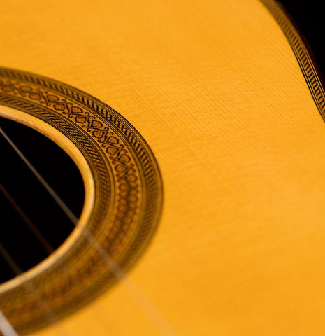 The soundboard and rosette of a 2009 Mariano Tezanos "Maestro" classical guitar made with spruce and CSA rosewood